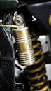 Detailed view of a vehicle's shock absorber system highlighting springs and mechanical components.