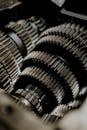 Detailed close-up of metal gears inside a machine showcasing precision engineering.